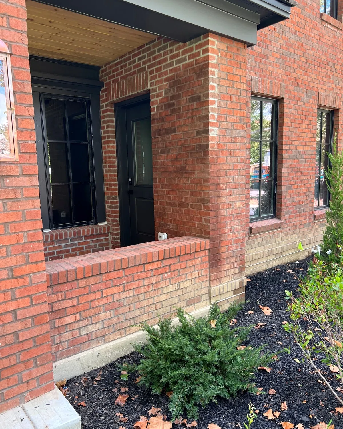 Red brick entry and porch wall