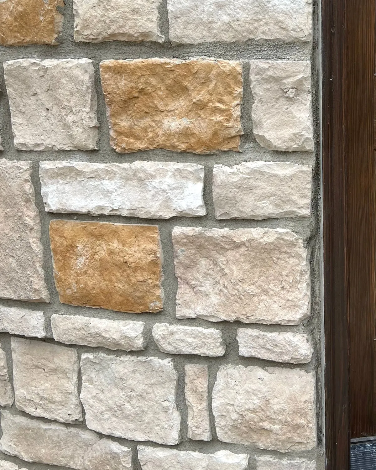 Stone veneer at an entry door