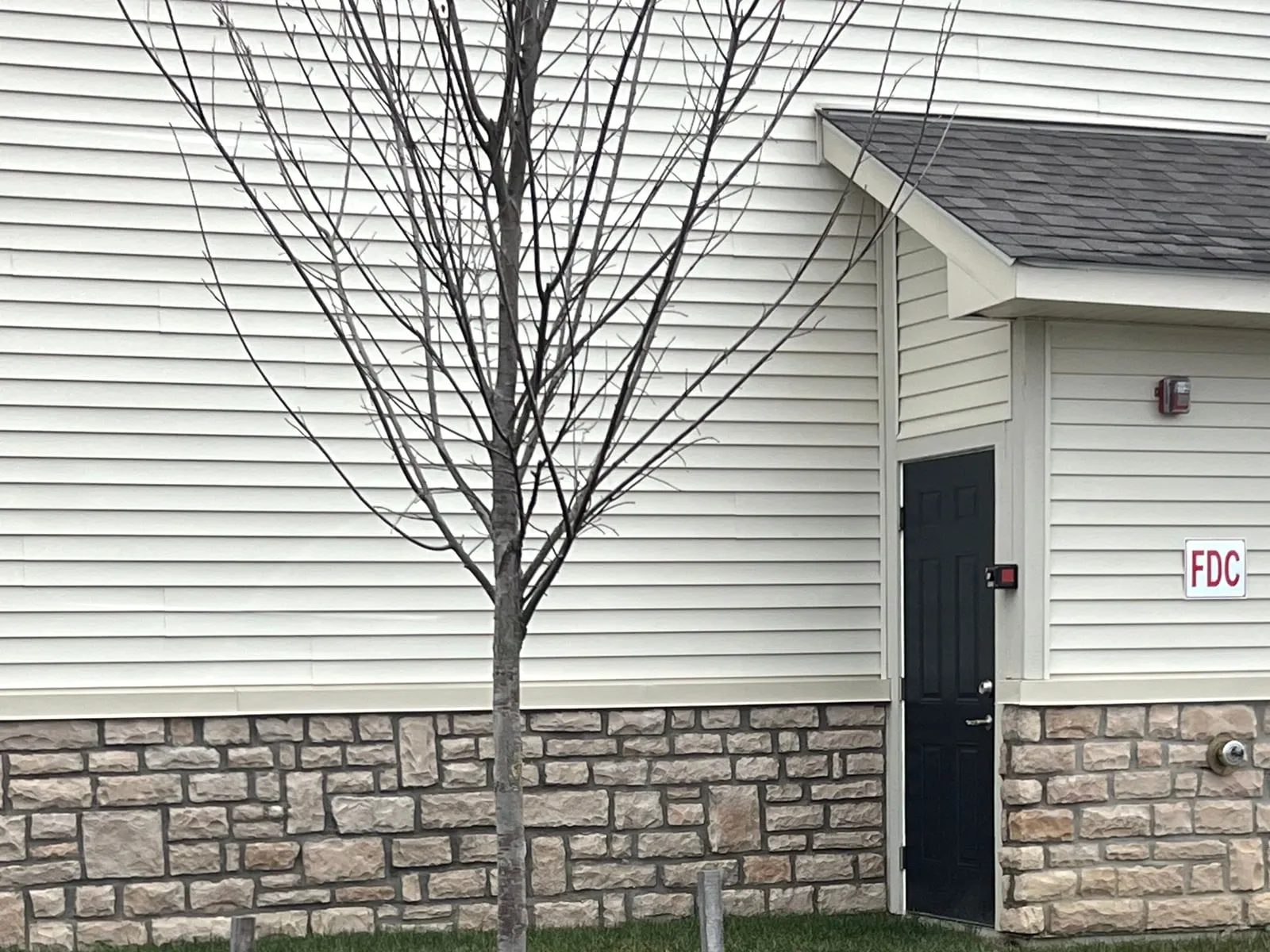 Siding over a stone base